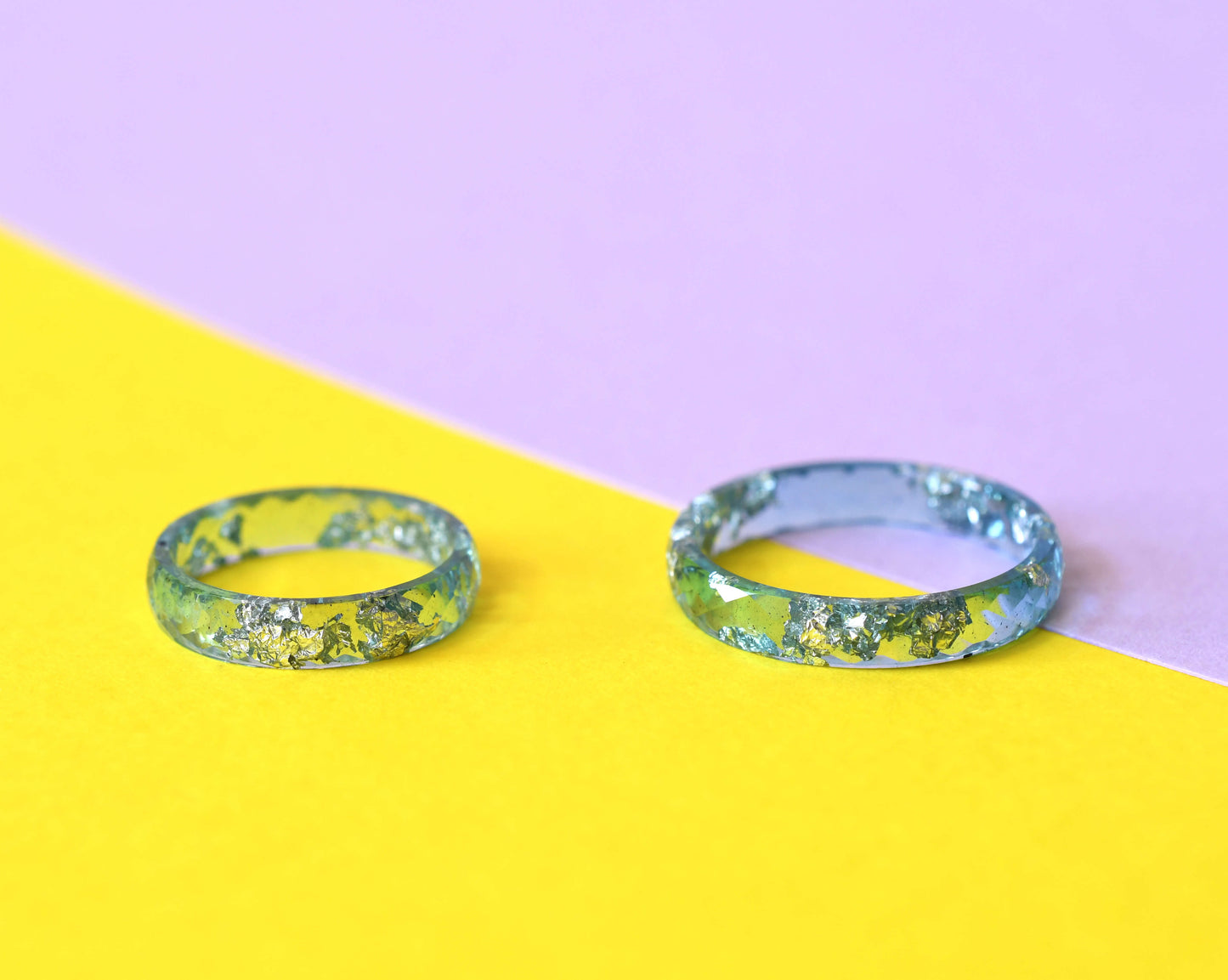 Close-up of silver flakes in transparent aqua resin band