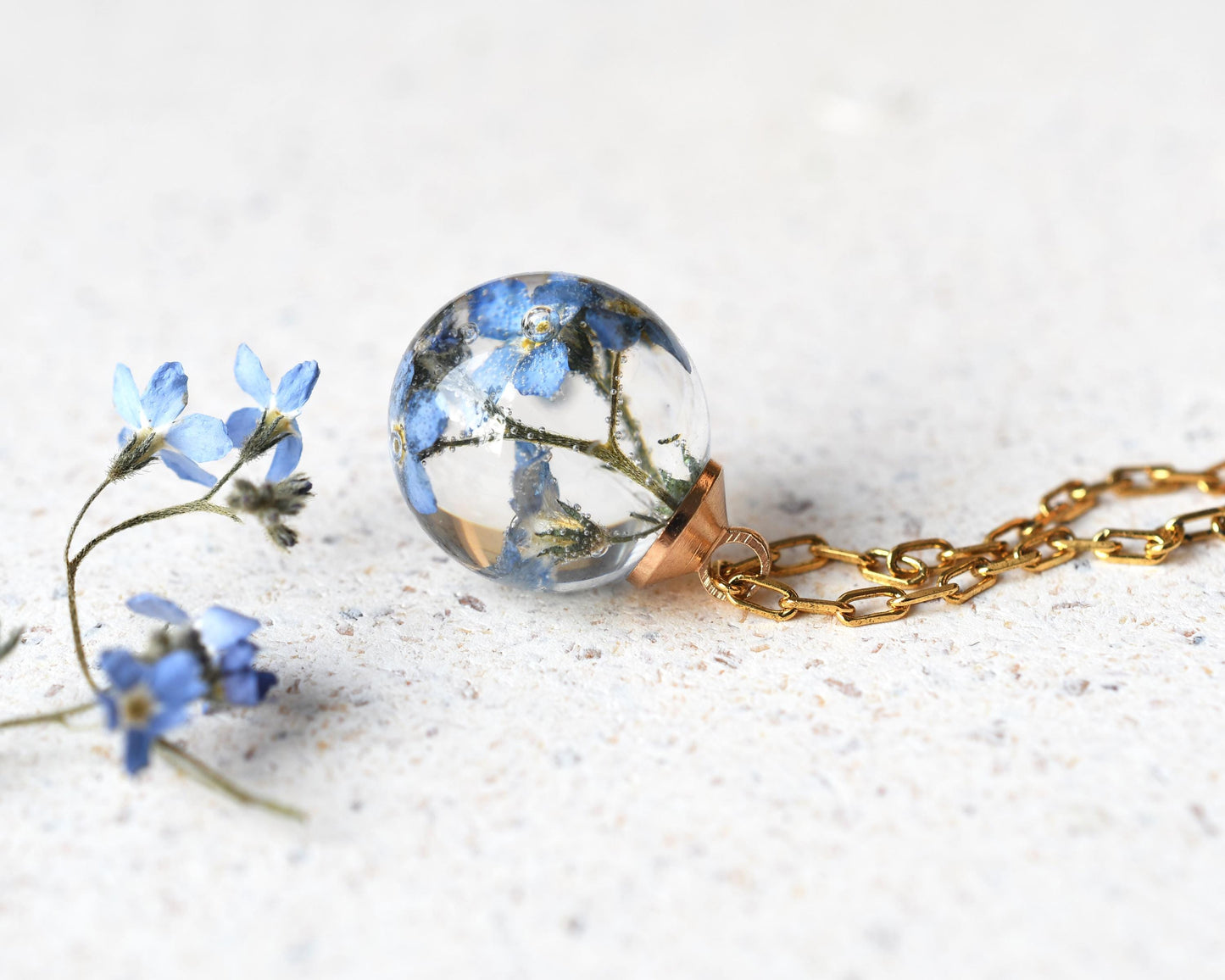 Forget-me-not memorial necklace styled with dried flower