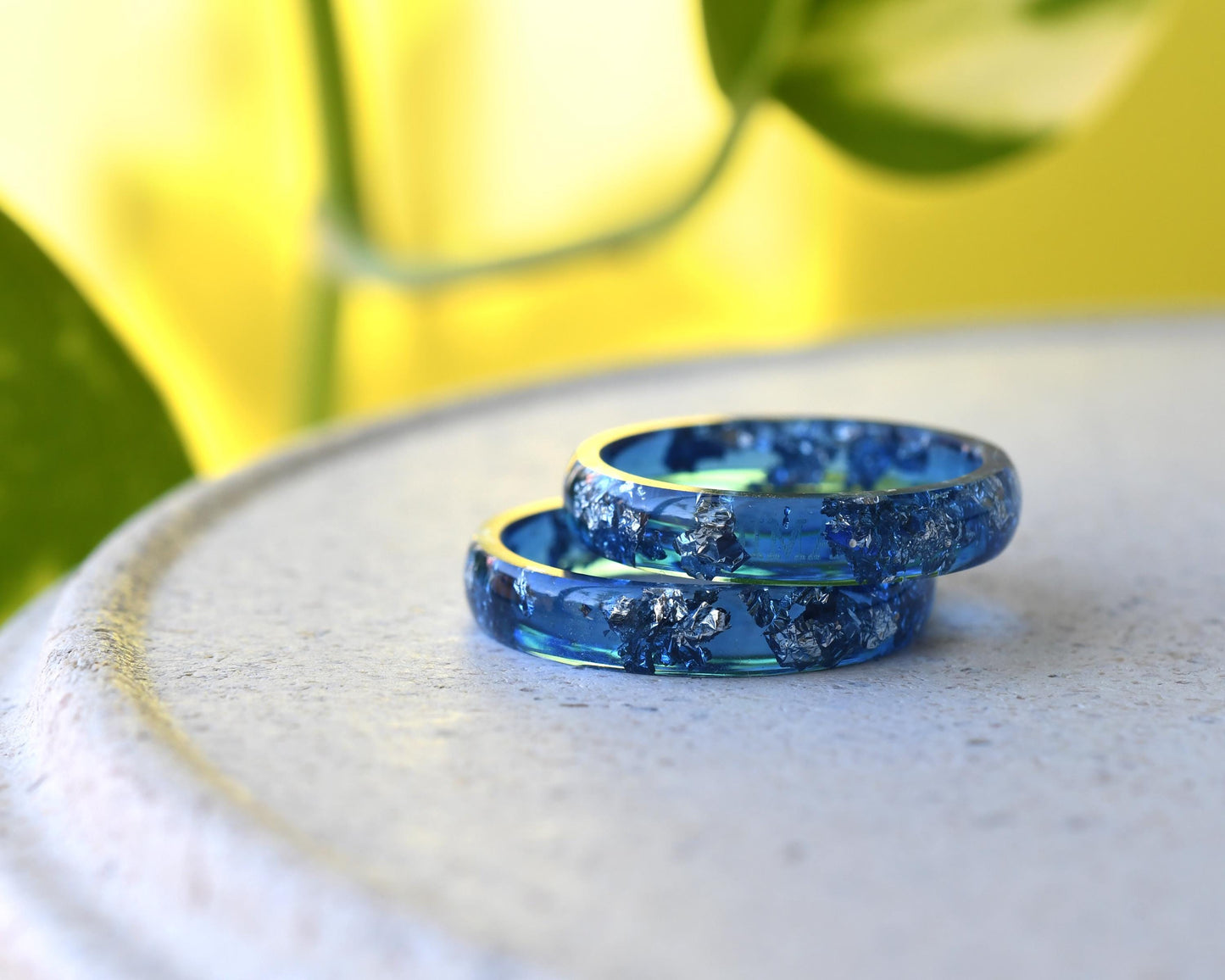Close-up of real silver flakes in navy resin band
