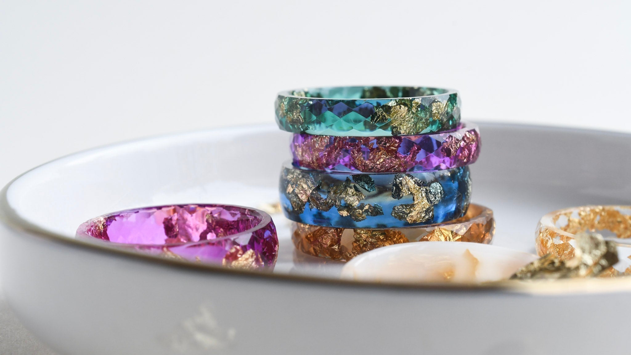 Chromatic resin ring — translucent color and metallic shimmer.