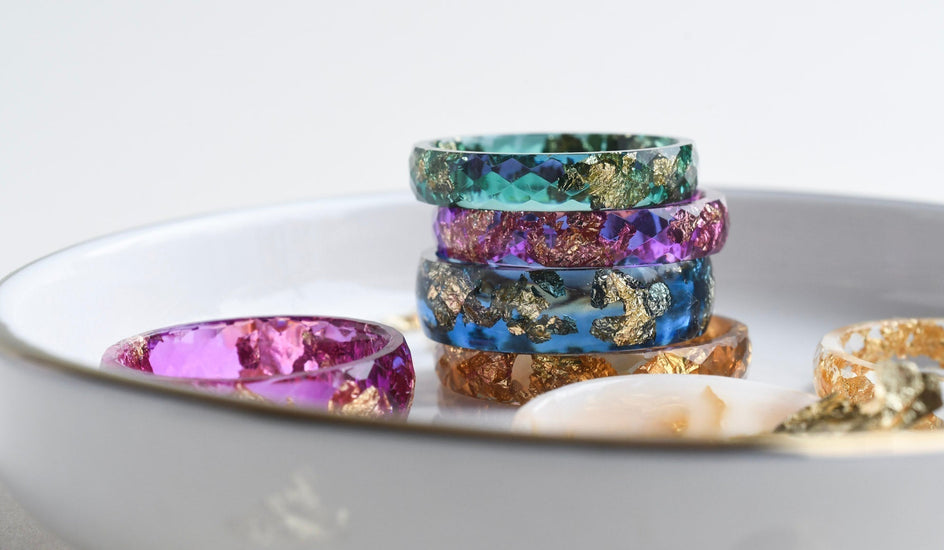 Chromatic resin ring — translucent color and metallic shimmer.