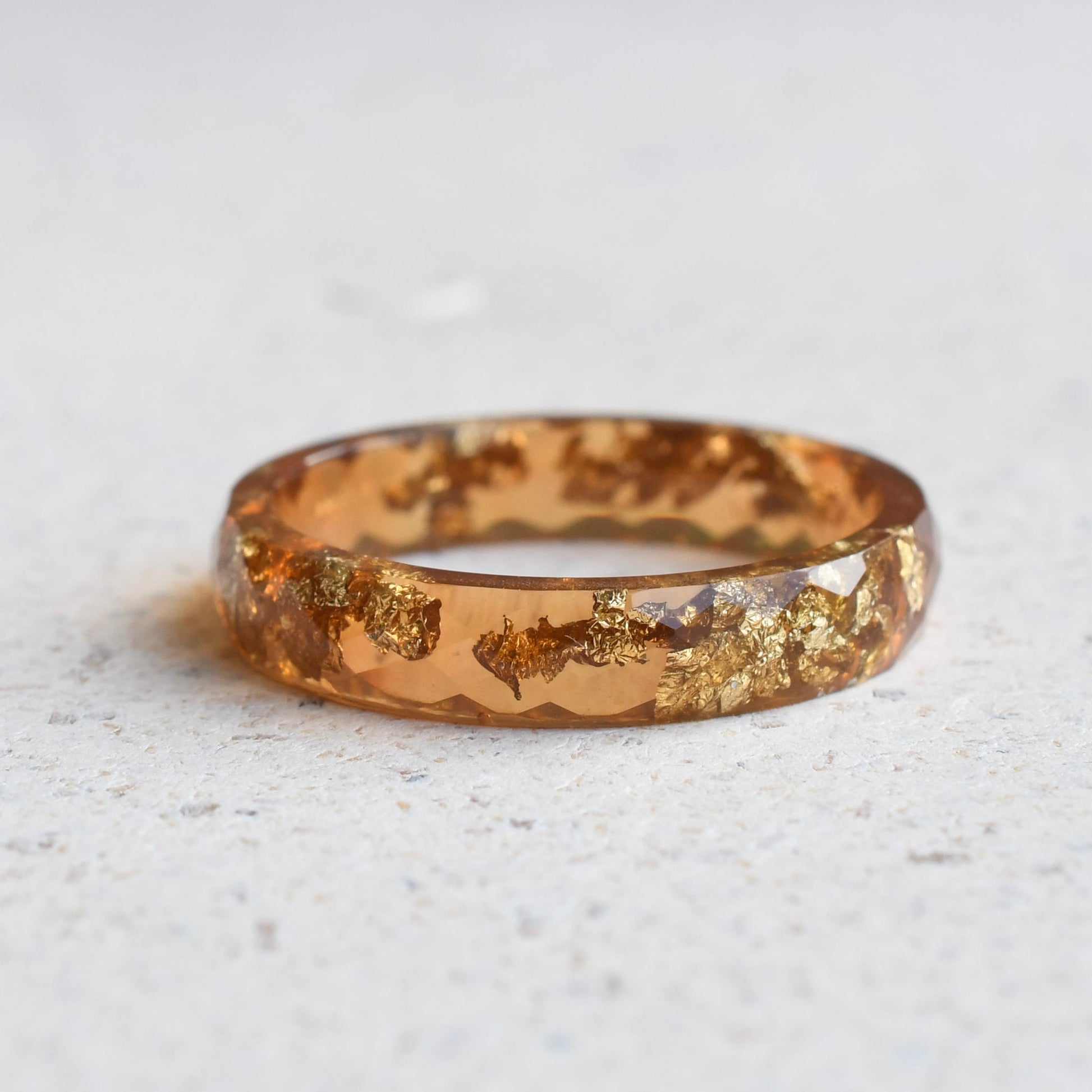 Amber resin stacking ring with metallic gold leaf
