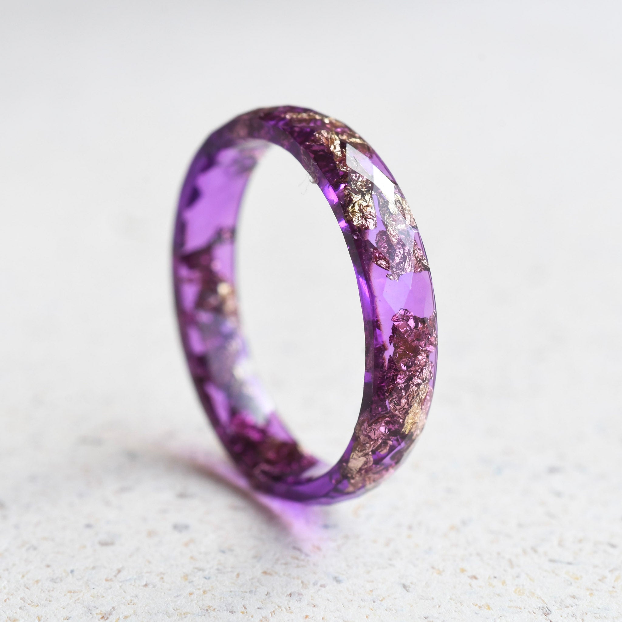 Handmade violet resin ring with metallic gold leaf by Resity Vienna
