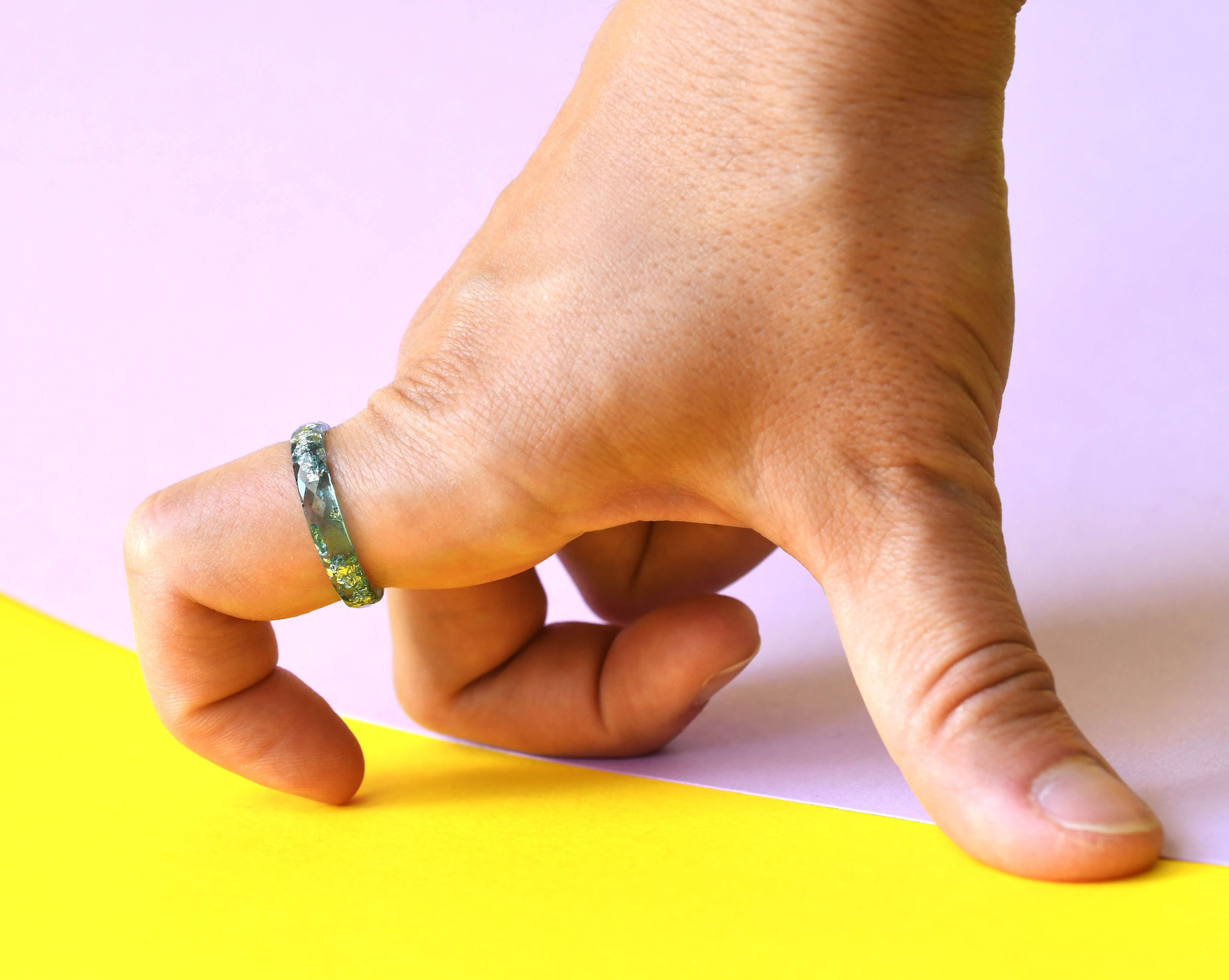 Handmade aqua and silver resin ring worn on hand