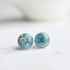 Aqua blue resin stud earrings with silver leaf handmade by Resity
