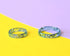 Close-up of silver flakes in transparent aqua resin band