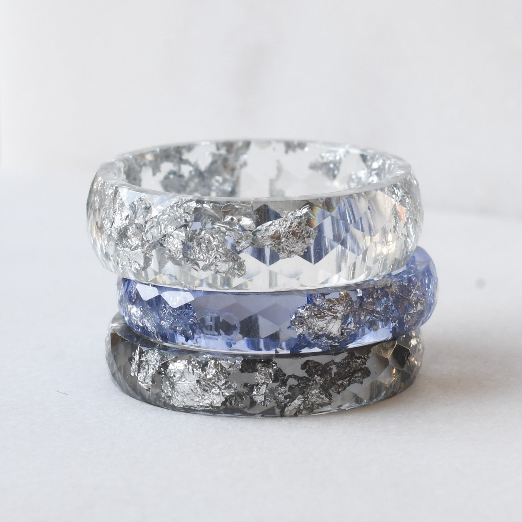aura stack with purple, clear and grey resin rings with silver flakes