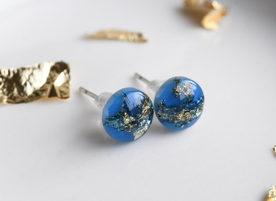 Blue resin stud earrings with gold leaf handmade by Resity in Vienna