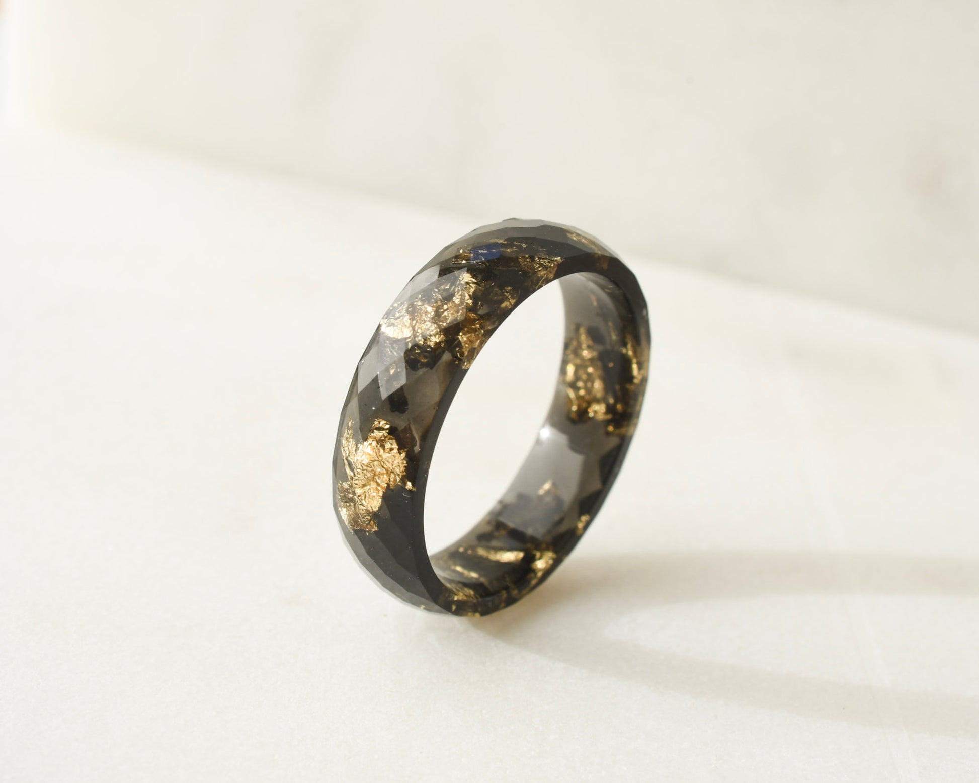 Modern unisex black resin ring with faceted band design