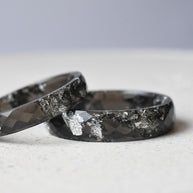 Faceted black resin rings with shimmering silver flakes — unisex design