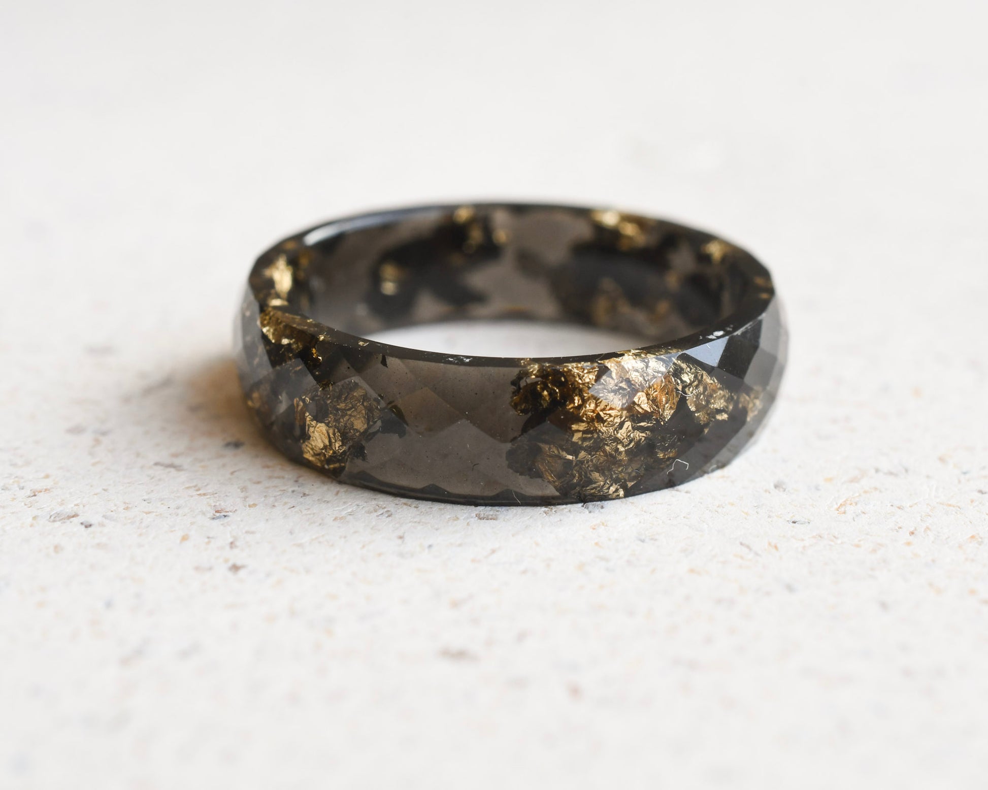 Handmade black resin ring with metallic gold flakes by Resity Vienna