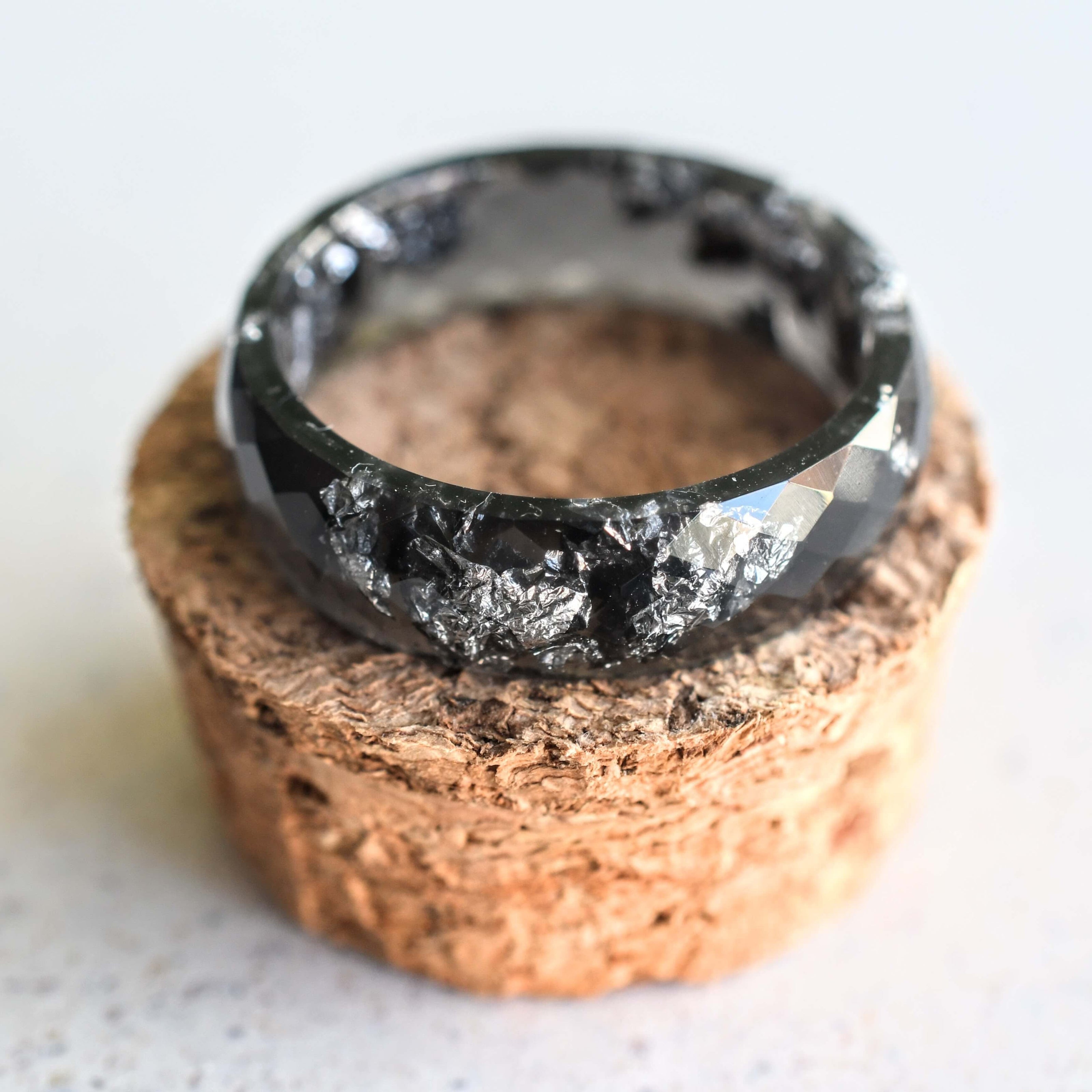 Black resin ring with silver flakes handmade by Resity in Vienna