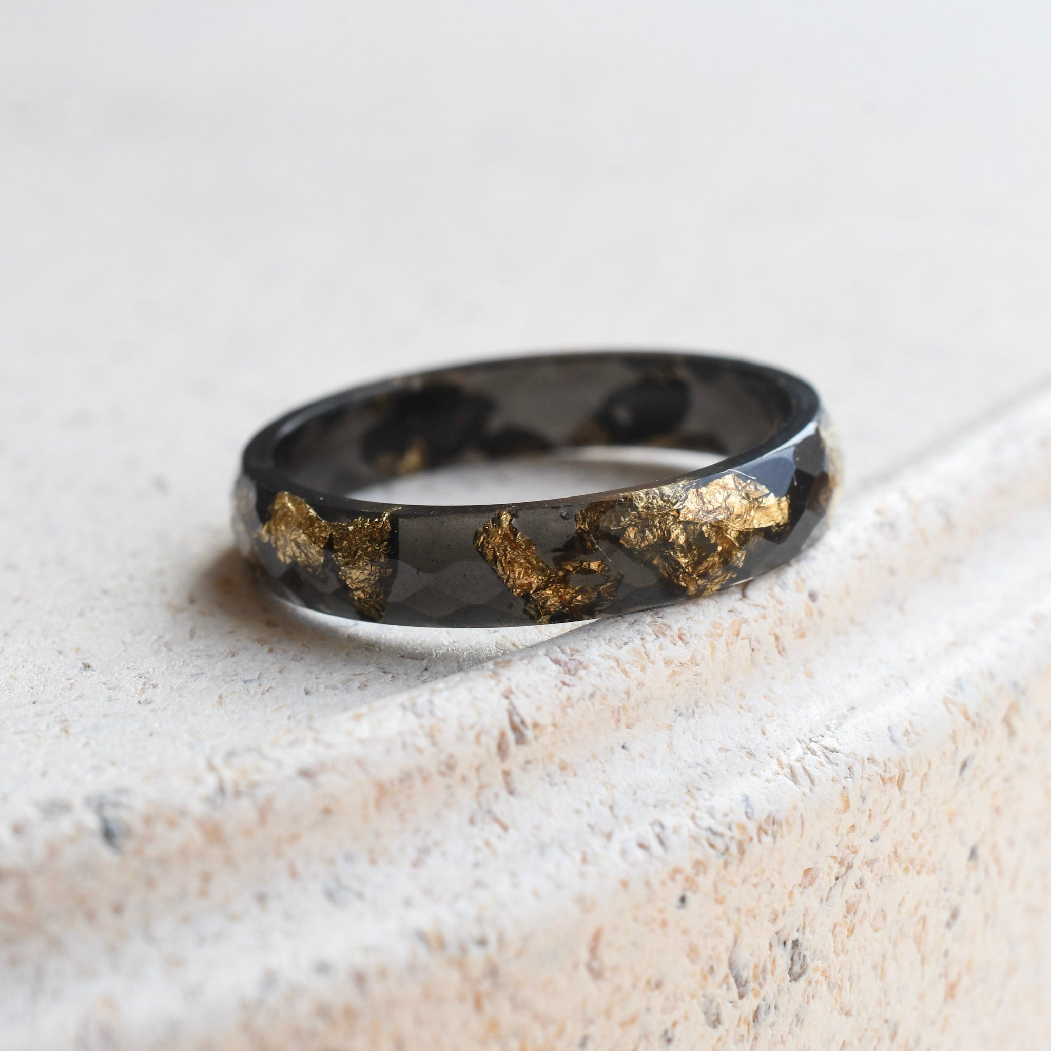 Handmade black resin ring with metallic gold leaf by Resity Vienna