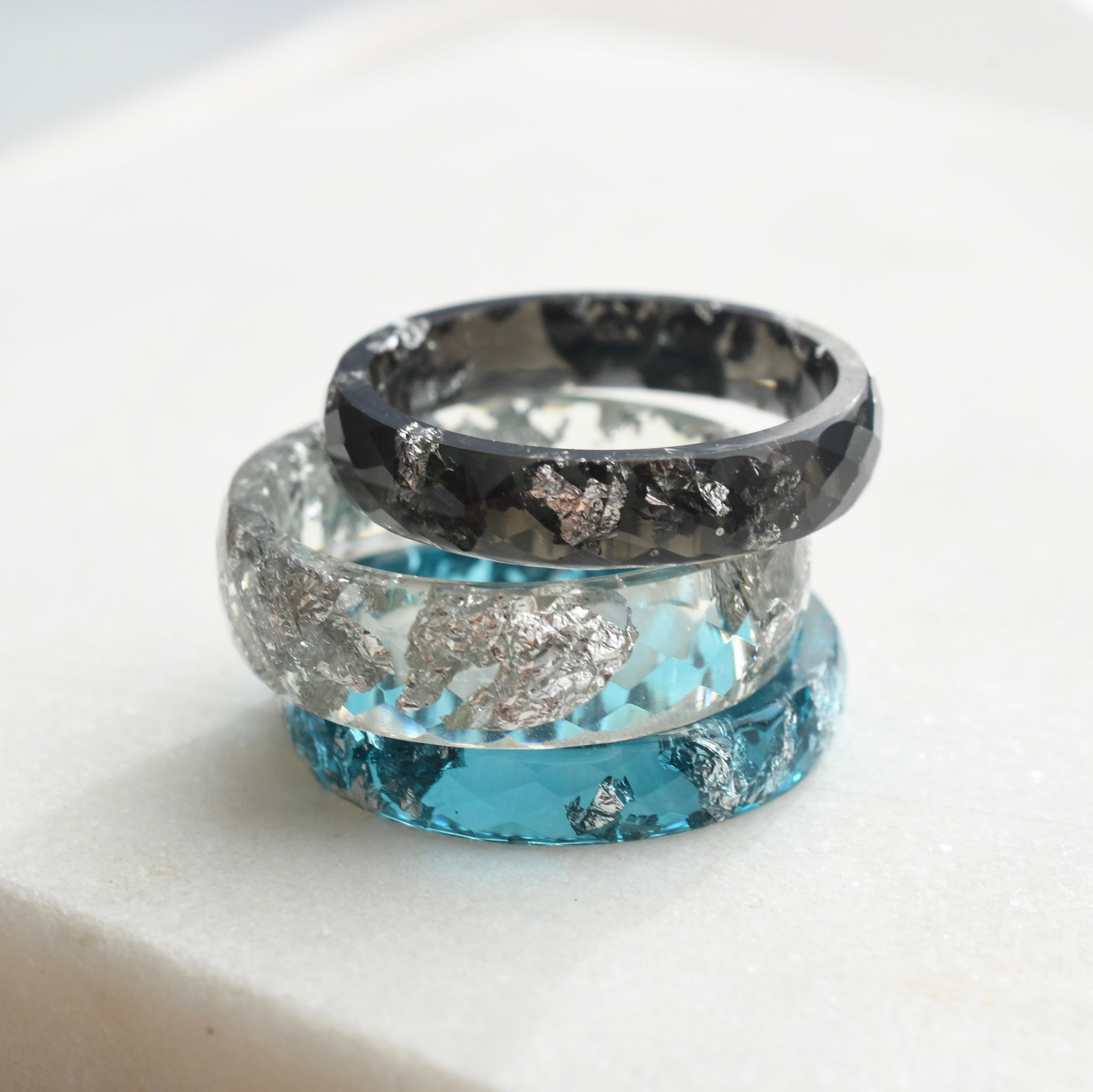 Faceted black minimalist stacking ring with silver leaf