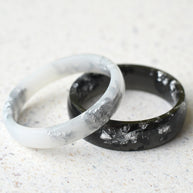 Smooth black and white resin rings with real silver leaf flakes — unisex design
