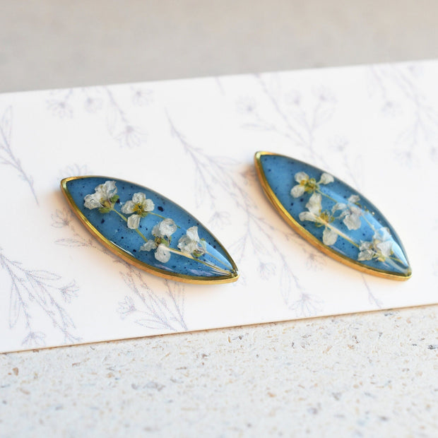 Blue resin stud earrings with real alyssum flowers handmade by Resity