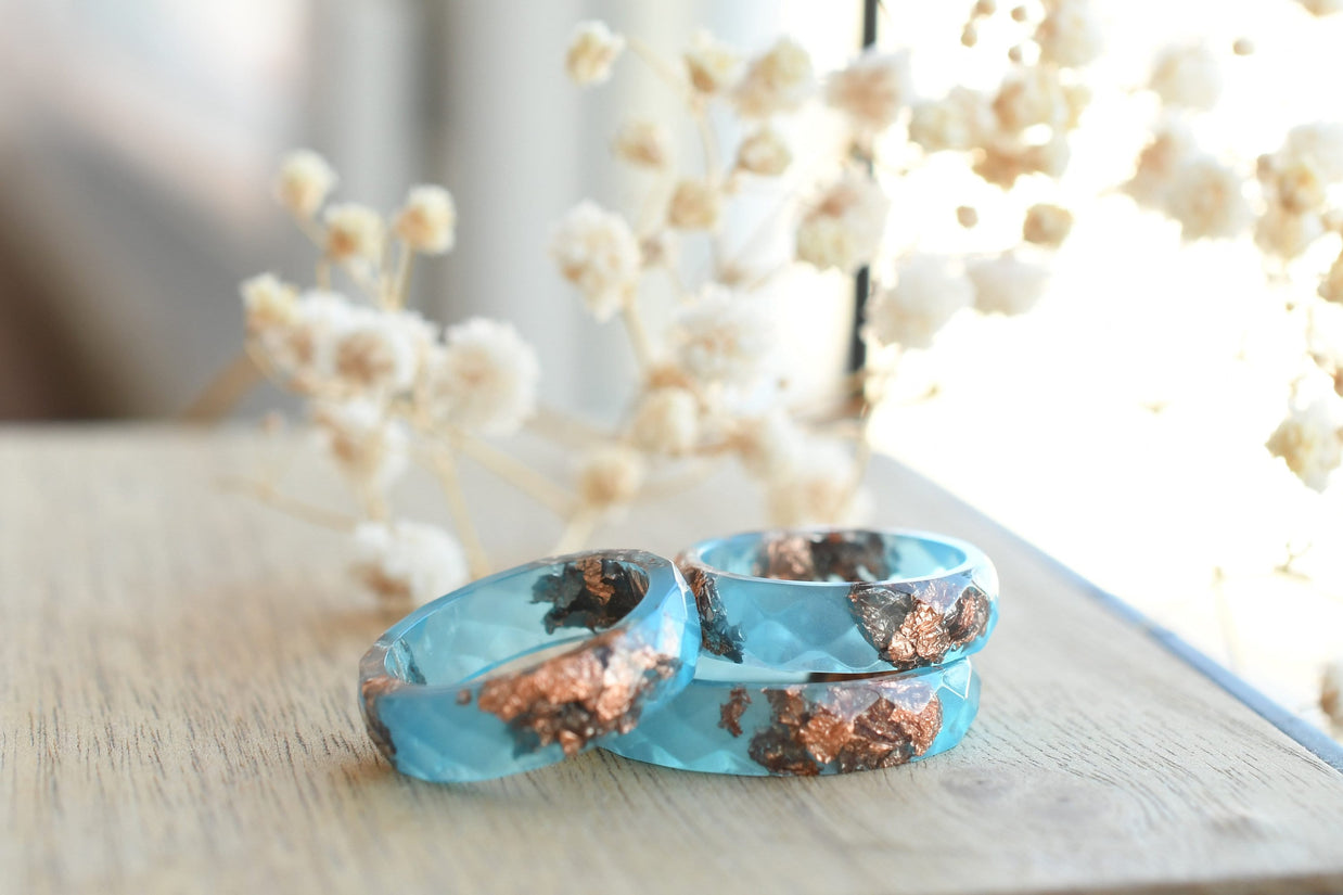 Blue Ember Ring stacked with other minimalist bands for a colorful, layered look