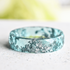blue 6mm faceted resin ring with silver flakes
