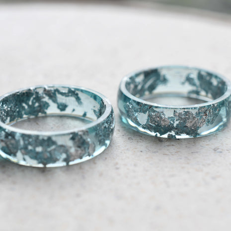 Close-up of silver leaf in blue resin ring
