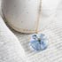 Blue squill flower preserved in resin and set on a gold-filled chain