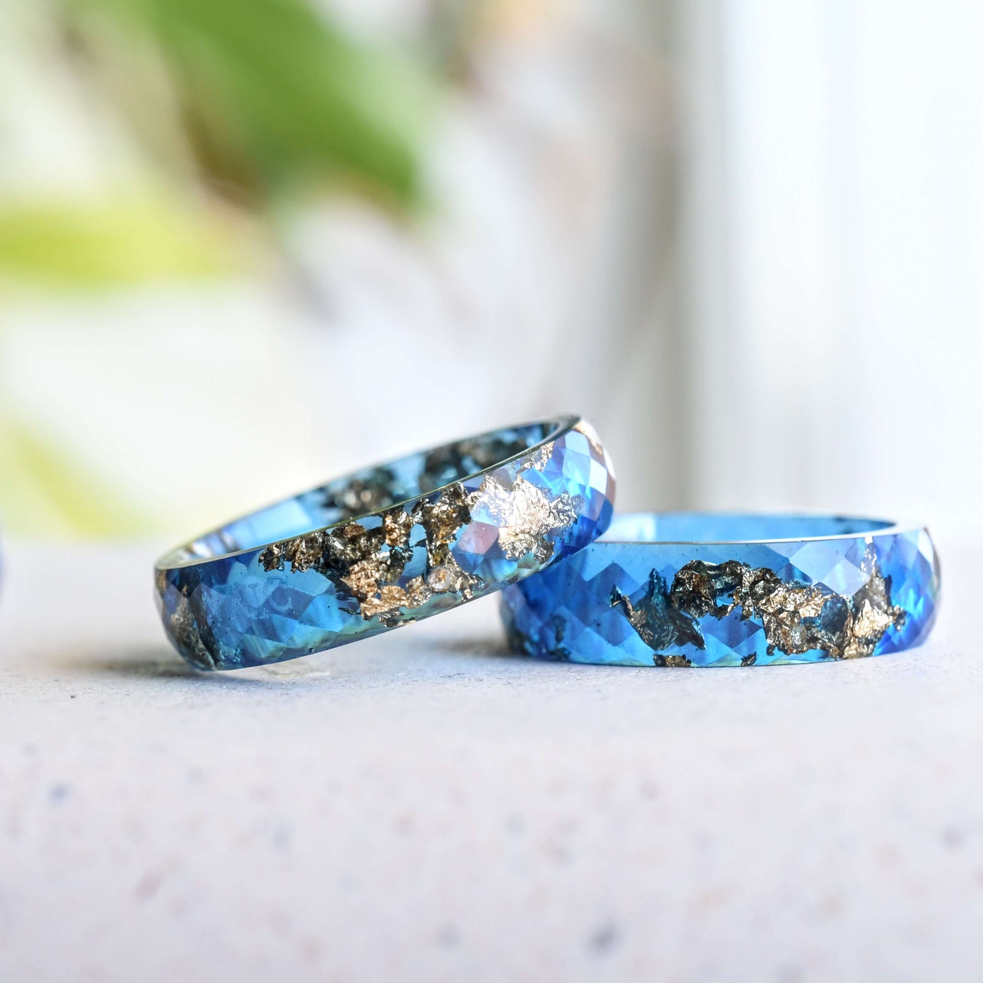 Deep sapphire resin ring with metallic gold flakes Vienna