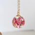 20 mm clear resin sphere pendant with heather flowers