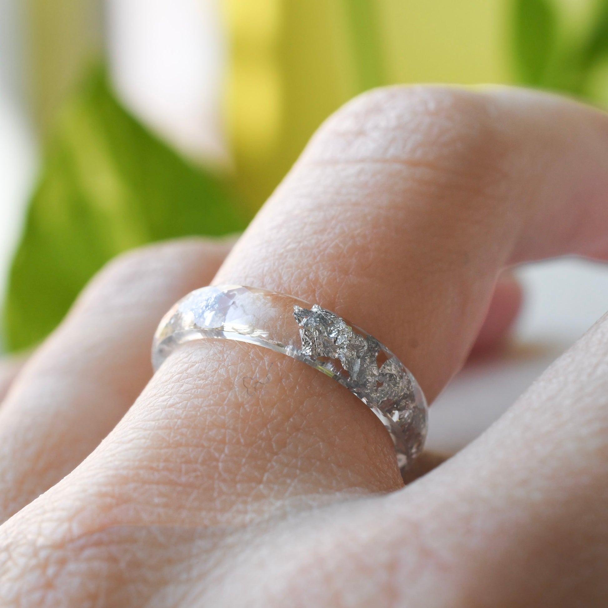 clear 4mm faceted resin ring with silver flakes