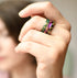 Colorful resin stacking rings with gold flakes worn on hand