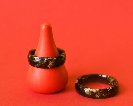Flatlay of Obsidian Signal Ring showing gold shimmer in sculpted black resin
