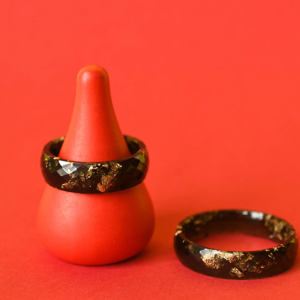 Flatlay of Obsidian Signal Ring showing gold shimmer in sculpted black resin