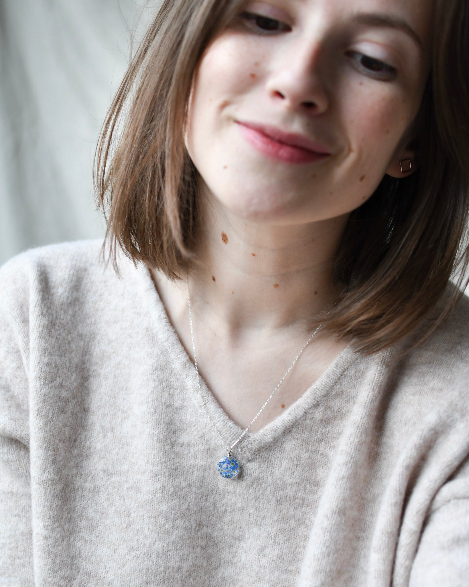 14 mm clear resin pendant with blue flowers handmade jewelry