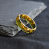 Dark amber gold men’s ring with modern faceted design