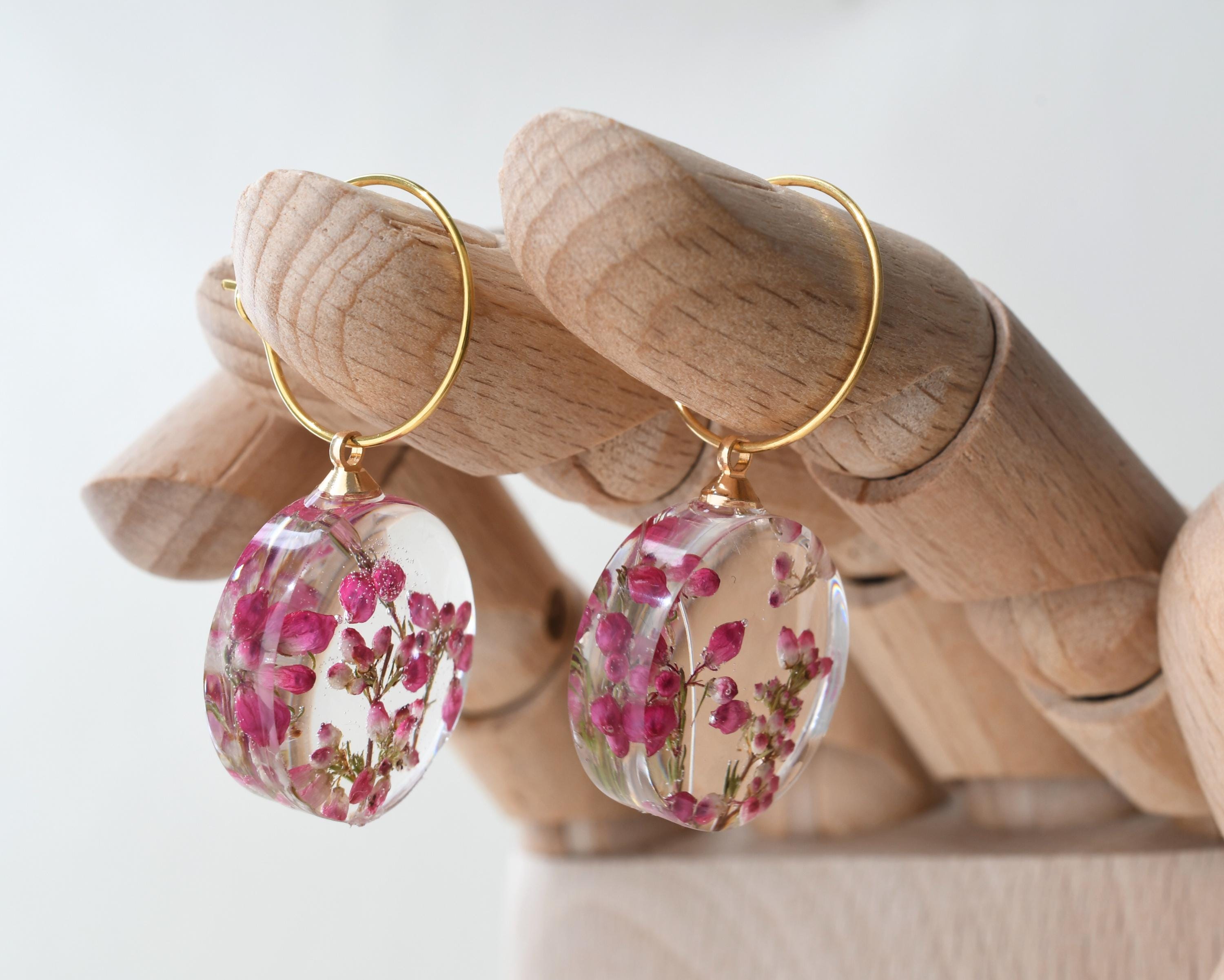 Delicate hoop earrings with real pink heather flowers preserved in resin
