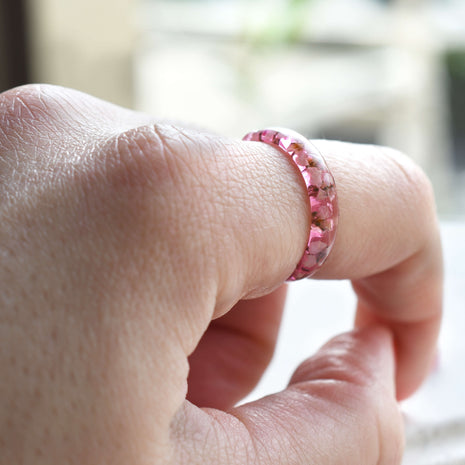 Dainty promise ring with real flower worn on hand