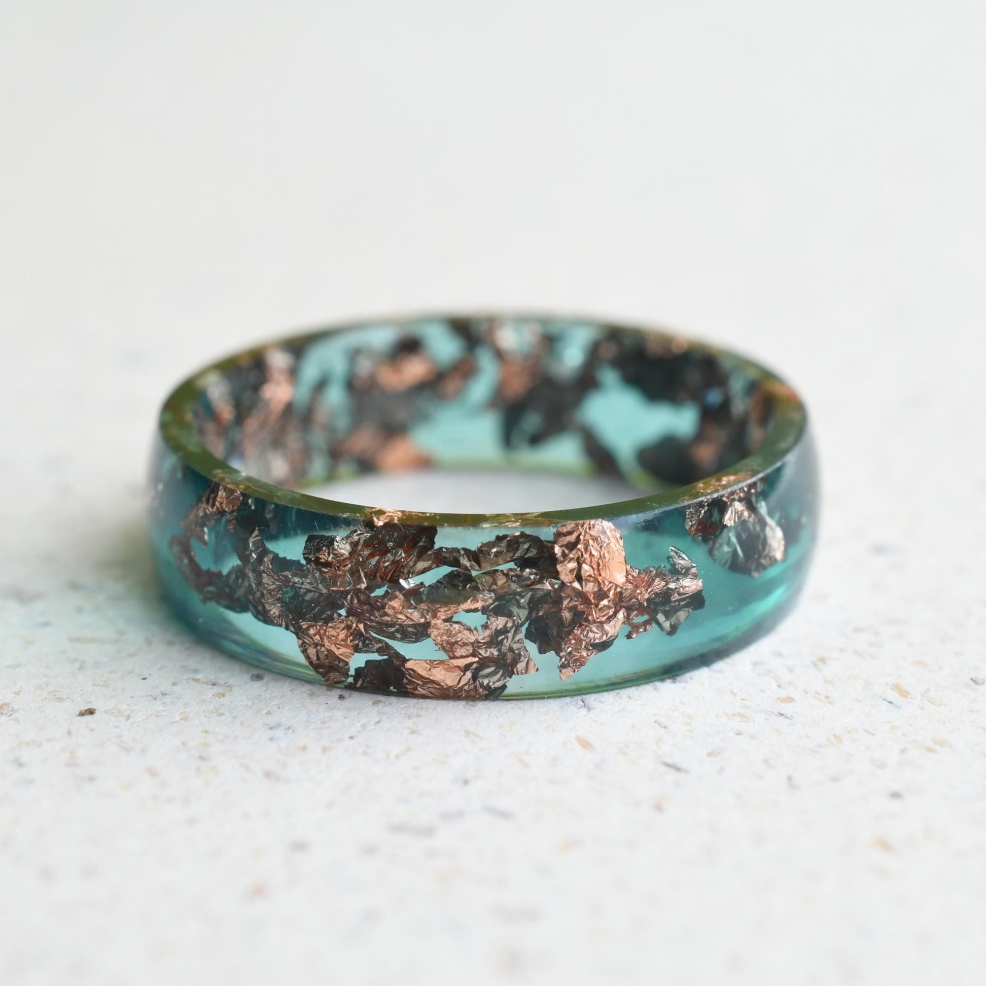 Emerald green resin ring with rose gold flakes handmade by Resity in Vienna
