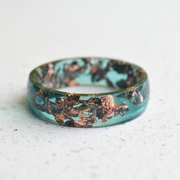 Emerald green resin ring with rose gold flakes handmade by Resity in Vienna