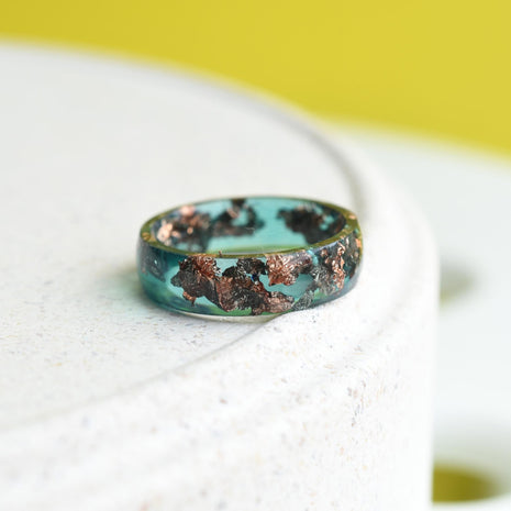 Smooth emerald resin ring with shimmering rose gold flakes — handmade jewelry