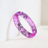 Faceted pink resin ring with metallic silver flakes