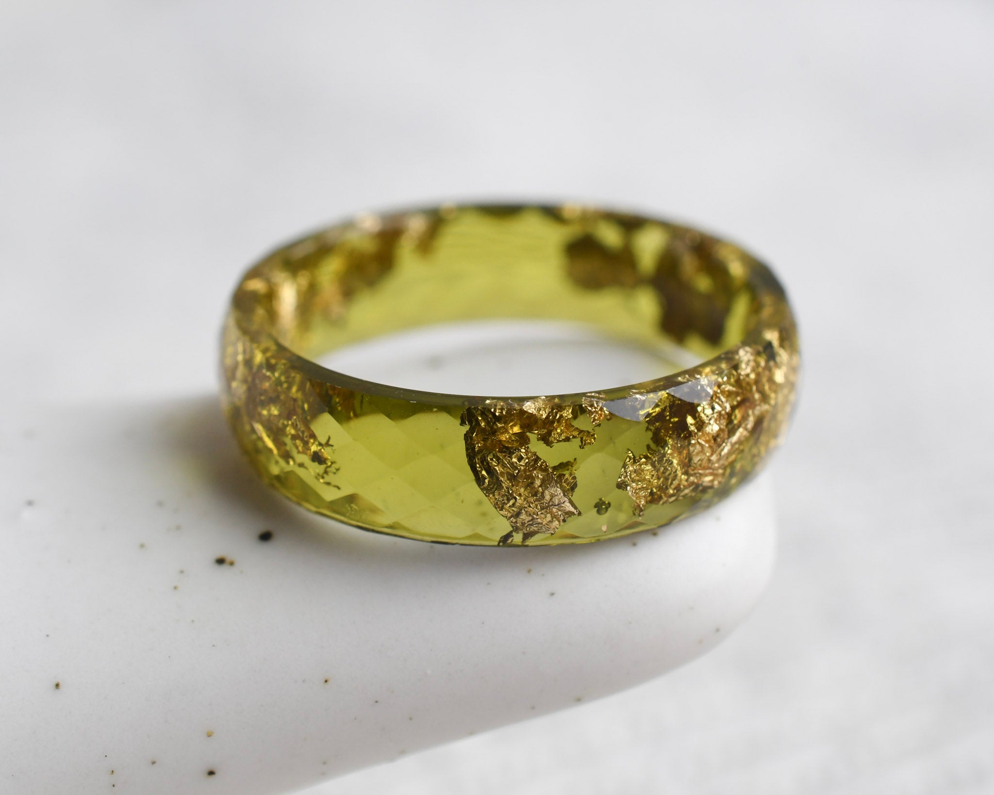 Faceted citrus yellow resin stacking ring with metallic gold leaf handmade in Vienna