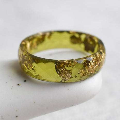 Faceted citrus yellow resin stacking ring with metallic gold leaf handmade in Vienna