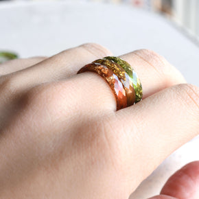 Resin ring with metallic gold flakes nature inspired