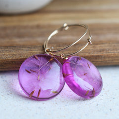 Gold-filled hoop earrings with floating dandelion seeds