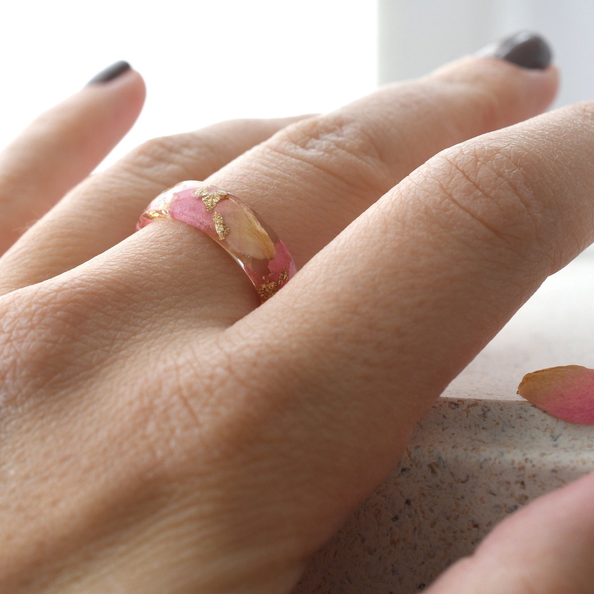 Golden Petal Ring worn on hand, highlighting botanical elegance