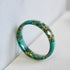 Faceted green resin stacking ring with minimalist design