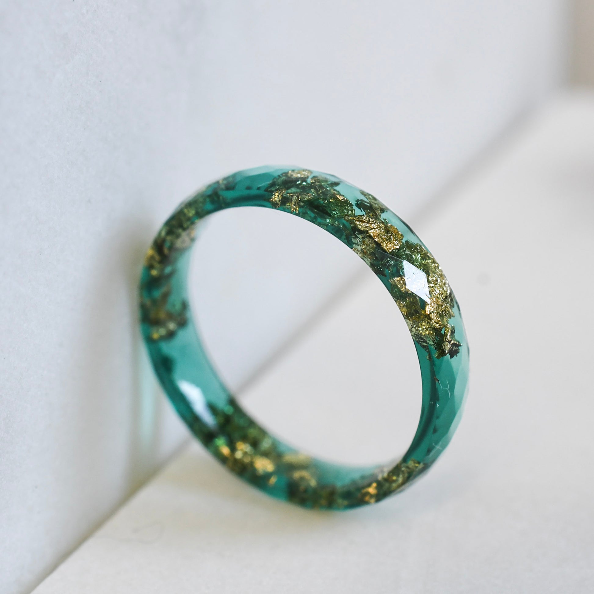 Faceted green resin stacking ring with minimalist design