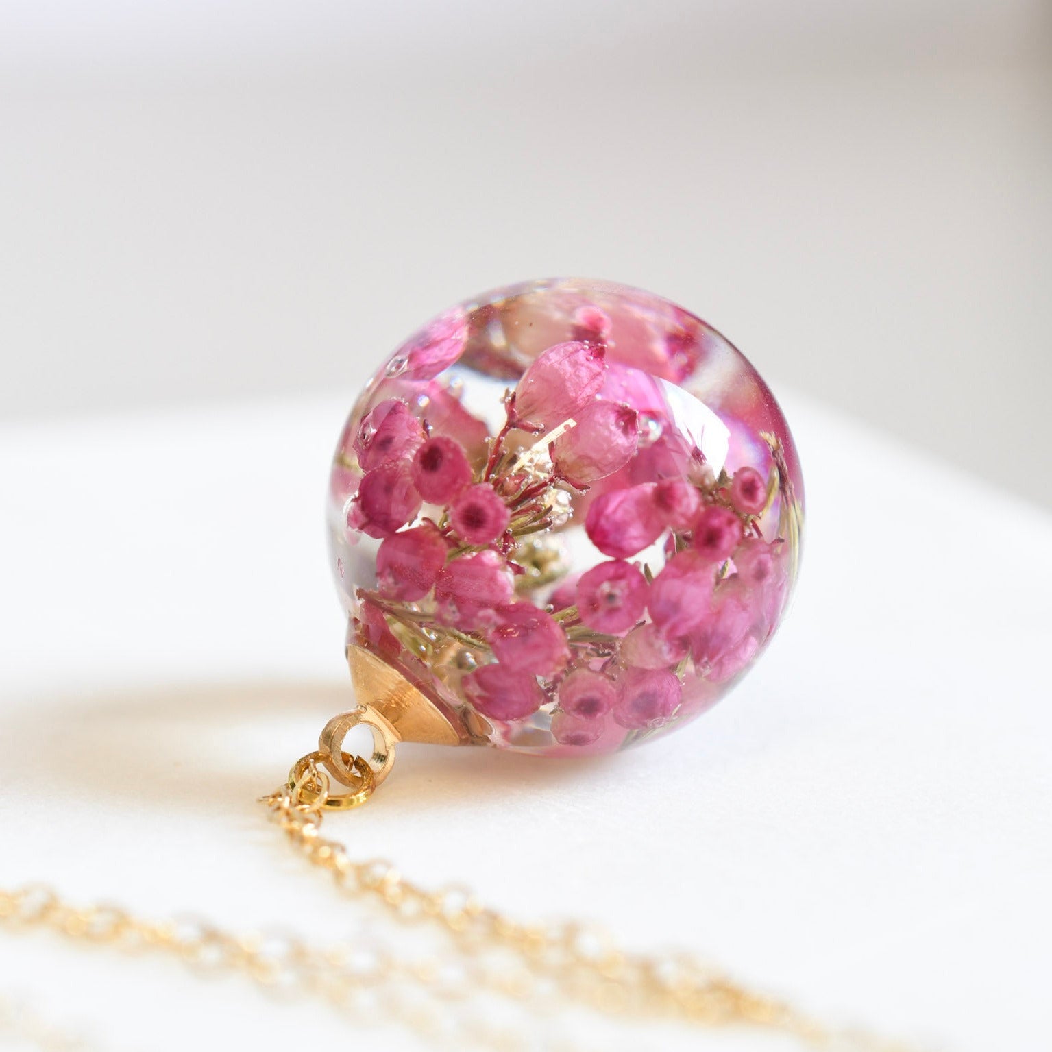 Real pink heather preserved in resin sphere necklace Vienna