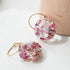 Floral hoop earrings with natural heather flowers, resin jewelry design