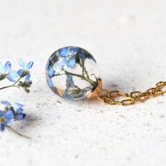 Forget-me-not memorial necklace styled with dried flower