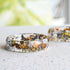 Faceted clear resin ring with gold, silver, and copper flakes — minimalist handmade jewelry