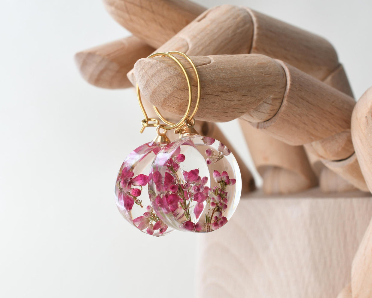 Botanical resin earrings with pink heather blossoms on gold-plated hoops